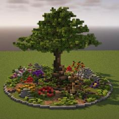 a tree is shown in the middle of a flowerbed with rocks and flowers around it