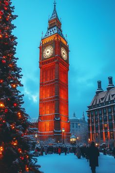 the big ben clock tower towering over the city of london at christmas time with lights on