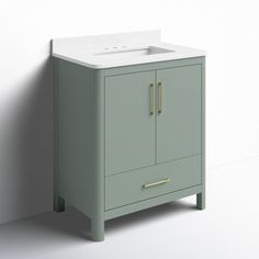 a white sink sitting next to a green cabinet