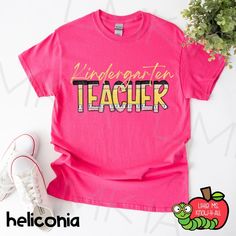 a pink t - shirt with the words i love my teacher on it and a pair of white sneakers