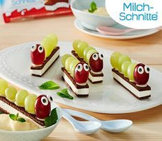 there are many desserts on the plate and one is made to look like a caterpillar