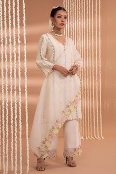 Ivory chanderi kurta with floral embroidery. Paired with a floral work pant and stole. - Aza Fashions White Unstitched Suit For Spring Festivals, White Unstitched Suit For Spring Festive, White Unstitched Suit For Spring Festive Occasion, White Unstitched Suit For Spring Wedding, White Unstitched Wedding Suit For Spring, Spring Festive White Unstitched Suit, White Georgette Palazzo Set With Gota Work, Traditional White Unstitched Suit For Spring, White Mulmul Palazzo Set With Floral Embroidery