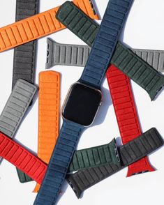 several apple watch bands laid out on top of each other