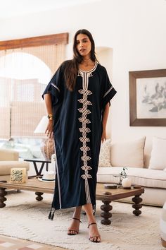 An elegant Moroccan caftan will make you feel like African royalty. It's extremely elegant with a dash of classy cotton embroidery in the front. Ideal for plus size women as well. Made of extremely soft fabric to make you feel free and beautiful at the same time.  This Kaftan is ideal to wear for any casual occasion. Whether taking a trip down the shopping lane, or home-based kitty parties, or about anything else, wearing this dress will make you feel classy and comfortable. Fabric : 70% Egyptia Oversized Cotton Kaftan, Black Bohemian Cotton Kaftan, Black Cotton Bohemian Kaftan, Oversized Tunic Abaya, Free Size Tunic Abaya, Black Cotton Short Sleeve Kaftan, Black Cotton Kaftan For Vacation, Embroidered Short Sleeve Kaftan For Eid, Black Cotton Maxi Kaftan