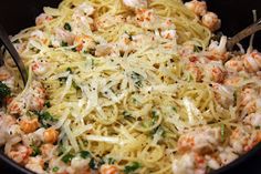 pasta with shrimp and parmesan cheese in a skillet ready to be eaten