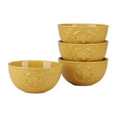 three yellow bowls are stacked on top of each other