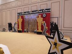 the stage is decorated with black and gold decorations for an oscar awards ceremony or party