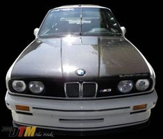 the front end of a silver bmw car