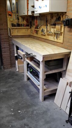 a workbench with tools on it in a garage