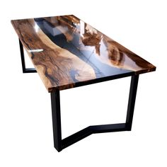 a wooden table with black metal legs and a wood slab on the top that is shaped like a boat