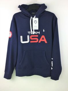 Polo Ralph Lauren Men 2022 Winter Olympic Team USA Official Fleece Hoodie Navy Get into the Olympic spirit with Polo Ralph Lauren's lightweight hoodie, which is made with recycled polyester. In addition to the "Team USA" graphic at the front, it features our signature embroidered Pony and the official logo patch of the U.S. Olympic Team. 60% Cotton, 40% polyester Official outfit of USA OIympic teams Ribbed hem Long sleeves with ribbed cuffs "Team USA" printed at the center front Polo Ralph Laure Sportswear Fleece Hoodie With Logo Print, Fleece Hoodie With Logo Print For Sports Season, Sports Logo Print Long Sleeve Hoodie, Team Spirit Long Sleeve Sports Hoodie, Sports Hoodie With Logo Print And Long Sleeves, Long Sleeve Sports Hoodie With Logo, Long Sleeve Moisture-wicking Fleece Hoodie, Moisture-wicking Long Sleeve Fleece Hoodie, Fleece Hoodie With Logo Print