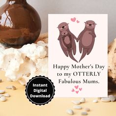 a mother's day card with two otters on it next to some mushrooms