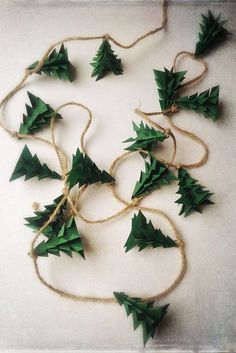 small green christmas trees tied together with twine