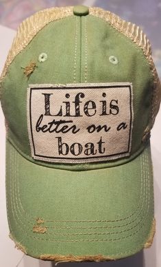 Vintage Distressed Trucker Cap "Life Is Better on a Boat" Cotton/Polyester blend. Mesh back. One size fits most, with an adjustable snapback. Unisex cap. Made In UNITED STATES Distressed Green Cap Hat, Green Distressed Cap, Distressed Green Cap, Trucker Hat With Letter Print In Cotton, Distressed Casual Trucker Hat For Outdoor, Casual Green Trucker Hat With Letter Print, Casual Distressed Trucker Hat For Outdoor, Casual Distressed Snapback Hat With Curved Bill, Casual Distressed Cotton Trucker Hat