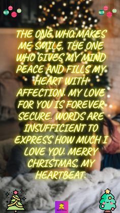 a person laying in bed under a christmas tree with the words, the one who makes me smile, the one who gives my hand peace and fills my heart