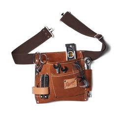 American made and built to last. This USA-made tool belt is constructed of thick suede and natural leather for lasting durability. The belt features two large and three small pockets along with a full-grain leather hammer loop and tape holder. Fits waist sizes of 29-46.” Leather Tool Belt, Leather Waist Bag, Utility Belt, Tool Belt, Favorite Boots, Belt Pouch, 영감을 주는 캐릭터, Leather Tooling, Waist Bag