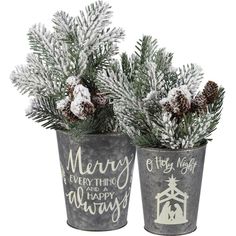 two metal christmas planters with pine cones and evergreen branches in them, decorated with merry lettering