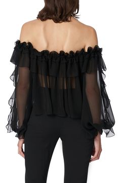 Captivate in this sheer silk-chiffon blouse detailed with ruffles down the sleeves and around the off-the-shoulder neckline punctuated by a glorious rosette. 23" center front length (size 16) Off-the-shoulder halter neck Long sleeves Sheer 100% silk Dry clean Made in the USA of imported fabric Women's Designer Clothing Latinx Owned/Founded Formal Black Organza Blouse, Elegant Black Organza Blouse, Formal Fitted Chiffon Tops, Silk Chiffon Tops For Evening, Black Organza Blouse With Sheer Sleeves, Chic Silk Chiffon Evening Tops, Sheer Silk Chiffon Top For Evening, Flowy Chiffon Top With Ruffles, Sheer Chiffon Party Top