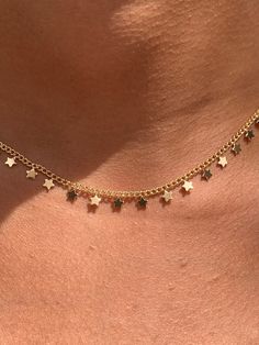 "Gold Filled Dangling Tiny Star Necklace (Adjustable) Chain Length: 16\" with 2\" extension Clasp: Spring Ring Finish: 18kt Gold Filled, Hypoallergenic, Will not tarnish Material: 18 Karat Gold Filled, Hypoallergenic. Tarnish Resistant. Gold-filled does not de-laminate or peel like Gold plated Jewelry nor does it tarnish as readily as silver. Generally speaking, gold filled is better quality and will have a much longer lasting color than plated jewelry. We recommend keeping abrasive chemicals aw Dainty Star-shaped Charms Jewelry, Celestial Star Jewelry With Delicate Chain, Dainty Star-shaped Charm Necklace, Dainty Star Shaped Charms Jewelry, Dainty Adjustable Star Charm Necklaces, Dainty Adjustable Star Charm Necklace, Star-shaped Charm Necklaces For Jewelry Making, Dainty Star Charm Necklaces, Celestial Star Charm Necklace With Clavicle Chain