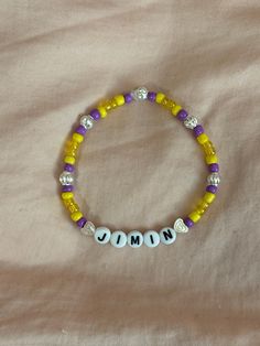 A hand-crafted glass bead friendship bracelet to celebrate Jimin of BTS! A cute concert accessory or a cute way to show off your favorite bias!  This bracelet is made with Czech glass beads, plastic letter beads, plastic spacer beads, and is on an elastic thread measured at about 10 inches in length for a relaxed/loose fit. If you would like the bracelet you order to be smaller or larger, please leave the requested size in inches in the personalization box!  All bracelets are made to order and are typically shipped out within 1-3 business days unless otherwise stated. Adjustable Round Beads Kpop Bracelets, Adjustable Beaded Kpop Bracelets, Personalized Kpop Beaded Bracelets With Round Beads, Adjustable Kpop Bracelets With Letter Beads, Adjustable Kpop Letter Beads Bracelets, Adjustable Kpop Bracelet With Letter Beads, Kpop Style Adjustable Beaded Bracelet For Birthday, Kpop Style Letter Beads Jewelry, Personalized Kpop Beaded Bracelets For Friendship