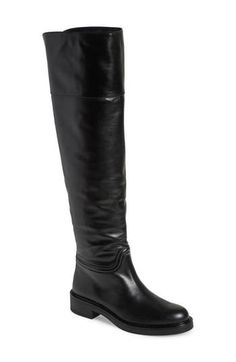 A classic riding boot takes a dramatic turn with smooth leather composition and an over-the-knee silhouette. 1 3/4" heel 20 1/2" shaft; 14" calf circumference Pull-on style Leather upper/synthetic lining and sole Made in Spain Classic Knee-high Riding Boots For Fall, Classic Wide Calf Knee-high Boots For Riding, Elegant Wide Calf Knee-high Riding Boots, Elegant Wide Calf Knee-high Boots For Riding, Elegant Wide Calf Riding Boots, Classic Riding Knee-high Boots Medium Width, Riding Knee-high Boots With Leather Sole, Elegant Knee-high Riding Boots, Elegant Fitted Riding Knee-high Boots