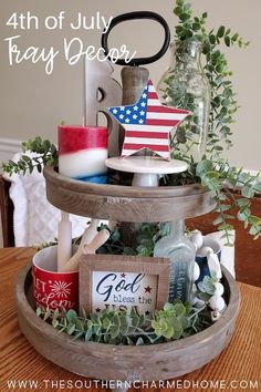 the fourth of july tray decor is displayed on a table with candles and other items