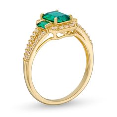 Make an elegant statement in this stunning lab-crated gemstone ring. 10K gold The ring showcases a 7.0 x 5.0mm emerald-cut bright green lab-created emerald center stone Smaller lab-created emeralds flank each side White lab-created sapphires border the center trio and line the open split shank Elegant Emerald Cut Emerald Ring With Halo Design, Elegant Emerald Cut Ring With Halo Design, Elegant Octagon Emerald Ring With Accent Stones, Elegant Green Octagon Diamond Ring, Elegant Green Emerald Baguette Cut Ring, Elegant Emerald Baguette Cut Ring, Elegant Baguette Cut Green Emerald Ring, Elegant Green Baguette Cut Emerald Ring, Elegant Baguette Cut Emerald Ring