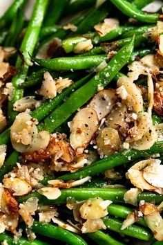 green beans and almonds are mixed together in a dish