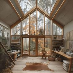 a room filled with lots of windows and furniture next to a wooden floor covered in dirt