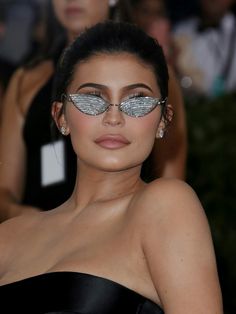 an image of a woman wearing sunglasses on the red carpet