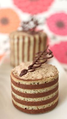 two small cakes sitting on top of a white plate