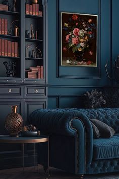 a living room with a blue couch and bookshelf in the corner, next to a coffee table