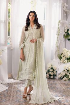 Luxury Neo Mint Embroidered Chiffon Pakistani Salwar Kameez exudes a delicate charm. The hand-embellished neck lace uplifts the look, adding a touch of sophistication. Paired seamlessly with raw silk bottoms enriched with an embroidered hem. Green Dupatta, Pakistani Salwar, Chiffon Sleeves, Organza Sleeves, Silk Bottoms, Pakistani Salwar Kameez, Embroidered Chiffon, Pure Chiffon, Embroidered Organza