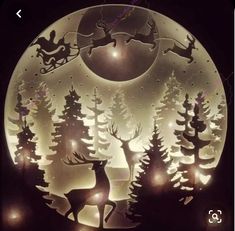 a paper cut christmas scene with reindeers and sleigh in the night sky