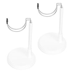 two white plastic holders with black handles