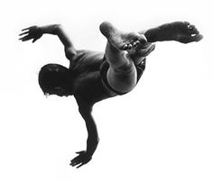 a man doing a handstand in the air