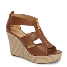 The Damita Platform Sandals Are The Ultimate Summer Wedge. The Heel Is The Perfect Height And The Lightweight Fabric Comes In Super Cute Colors. The Zipper Detail Along The Front Provides The Chic And Glamorous Touch That Michael Kors Is Known For. 3-3/4" Espadrille Wedge Heel, 1" Platform, Feels Like 2-3/4" Heel Round Open-Toe Platform Wedge Sandals With Zipper Color: Brown Size: 10 New With Box Michael Kors Brown Sandals For Summer, Michael Kors Brown Wedge Heel Sandals, Michael Kors High Heel Platform Wedge Sandals, Spring Michael Kors Leather Wedge Sandals, Chic Michael Kors Wedge Heel Sandals, Michael Kors Casual Wedge Sandals, Michael Kors Wedge Heel Sandals For Spring, Michael Kors Platform Wedge Sandals For Summer, Michael Kors Platform Wedge Sandals For Beach