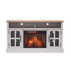 a white entertainment center with an open fire in the fireplace and two doors on each side