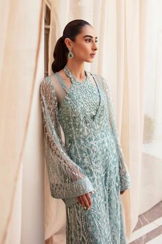 Classic Aqua Blue Embroidered Pakistani Wedding Dress Gown Shirt is a work of art featuring a chic embellished net that Evokes a sense of magnificence. Embroidered Evening Gown For Eid, Hand Embellished Floor-length Embroidered Wedding Dress, Hand-embellished Floor-length Wedding Dress, Elegant Hand-embellished Embroidered Wedding Dress, Elegant Hand Embellished Wedding Dress, Elegant Hand-embellished Wedding Embroidered Dress, Glamorous Gown For Eid, Elegant Resham Embroidered Dress For Reception, Elegant Embroidered Dress With Sequins For Wedding