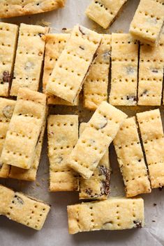 crackers are arranged on a piece of parchment paper