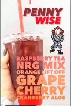 a person holding up a drink in front of a sign that says, raspberry tea n r g mix orange lift off grape cherry cranberry ale