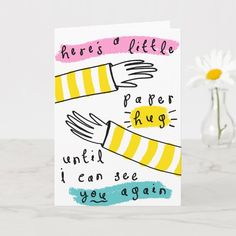 there's a little paper hug until i can see you again card with flowers in the background