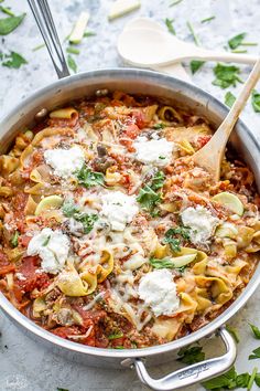 a large pot filled with pasta and sauce