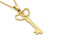 "A necklace in Stainless Steel with a golden key pendant that is 38 mm (a bit under one and a half inches) long. It is matte on the back and has the word \"Love\" on it. The chain is included and is 18\" (45 cm) long plus a 2\" extender is also attached! The jewelry is Nickel safe and we test it regularly." Gold Heart Necklace With Two Keys, Key Necklace Gold, Heart Skeleton Key, Heart Skeleton, Skeleton Key Necklace, Golden Key, Love Jewelry, Key To My Heart, Skeleton Key