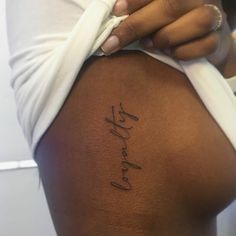 a woman's back with the word love written on it