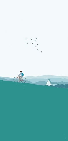 a person riding a bike in the middle of an ocean with birds flying over them