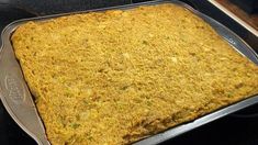 a square casserole sitting on top of a stove