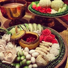 there are many different types of food on the table together in this plate, including flowers and shells