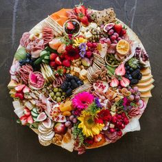 a platter filled with assorted fruits and veggies