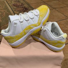 All-New Air Jordan 11 Low “Yellow Snakeskin”. This New Women’s Colorway Of The Air Jordan 11 Low Will Get Covered In A White/Tour Yellow-Sail Color Makeup. It Will Feature A White Leather Upper Which Is Then Contrasted By Yellow Snakeskin On The Mudguards. White Rubber Midsoles And Milky White Translucent Outsoles Will Round Out The Design On This Air Jordan 11 Low. 100% Authentic Nike Product. Brand New Without Original Box. Replacement Box Will Be Provided Size: 10.5 Women Jordan 11 Snakeskin, Yellow Snakeskin Jordan 11 Outfits, Yellow Custom Sneakers With Cushioned Footbed And Round Toe, Yellow Custom Sneakers With Cushioned Footbed, Yellow Low-top Custom Sneakers With Boost Midsole, Yellow Low-top Custom Sneakers With Cushioned Footbed, Yellow Synthetic Basketball Shoes With Cushioned Footbed, Yellow Custom Sneakers With Speckled Midsole For Streetwear, Yellow Custom Sneakers With Air Cushioning